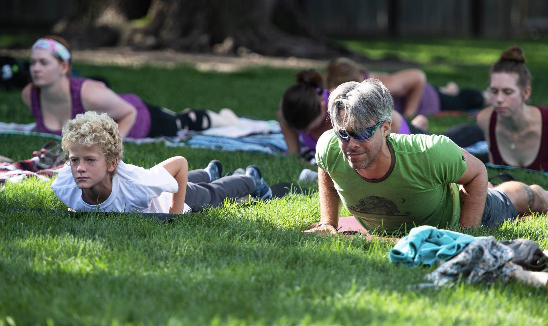 Photo of Austin in baby cobra pose in the park