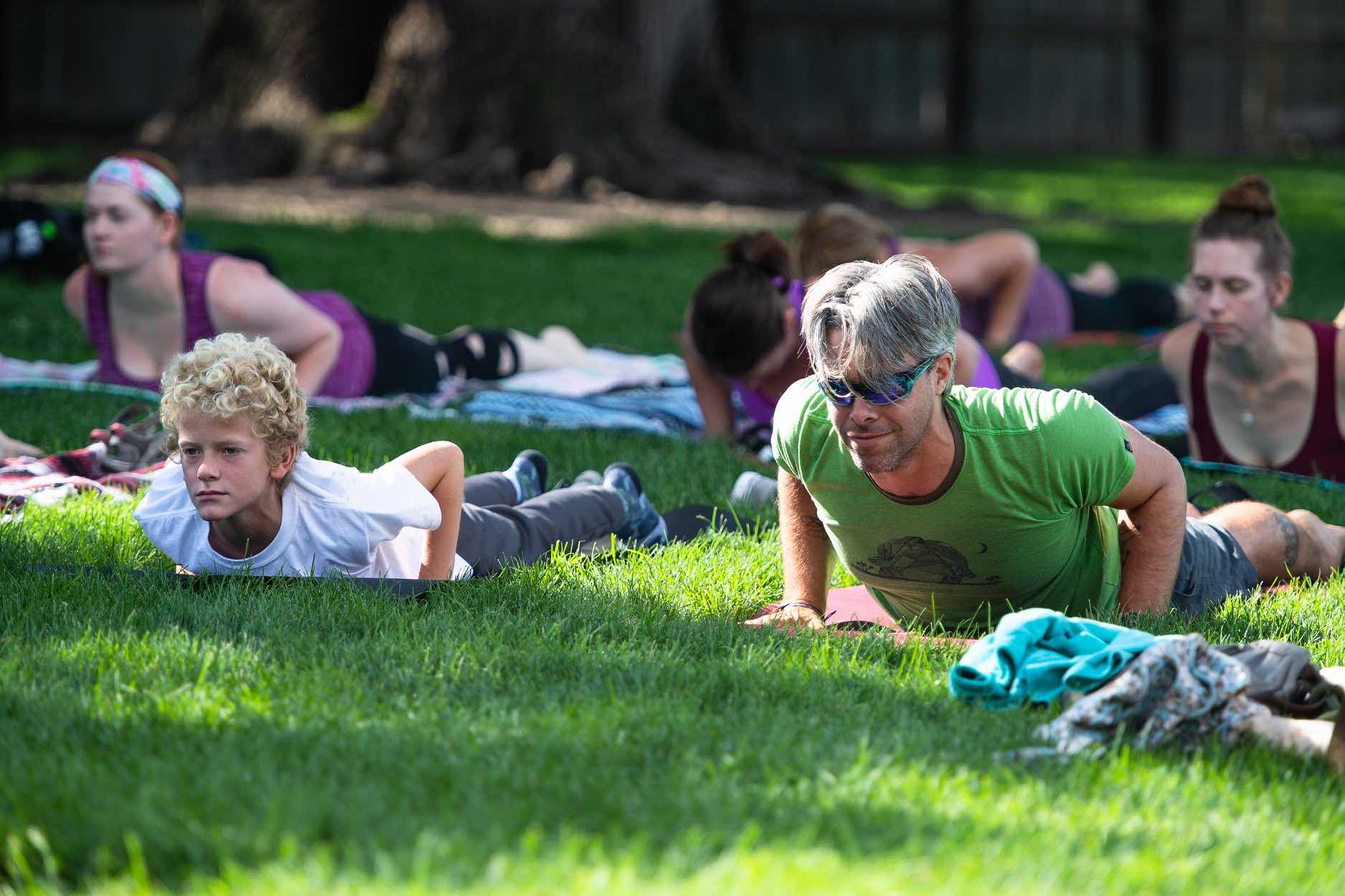 Photo of Austin in baby cobra pose in the park