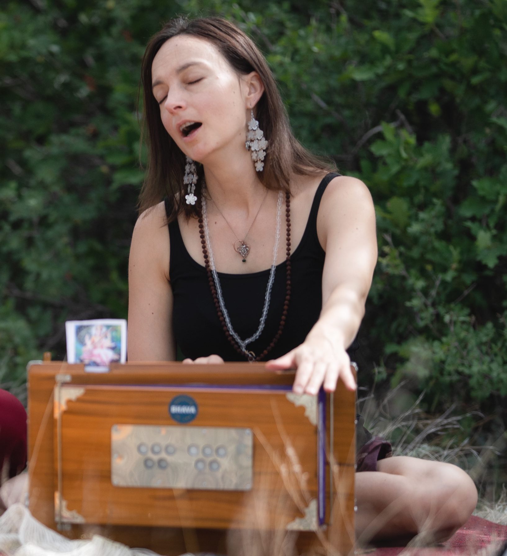 Suzanna playing a harmonium